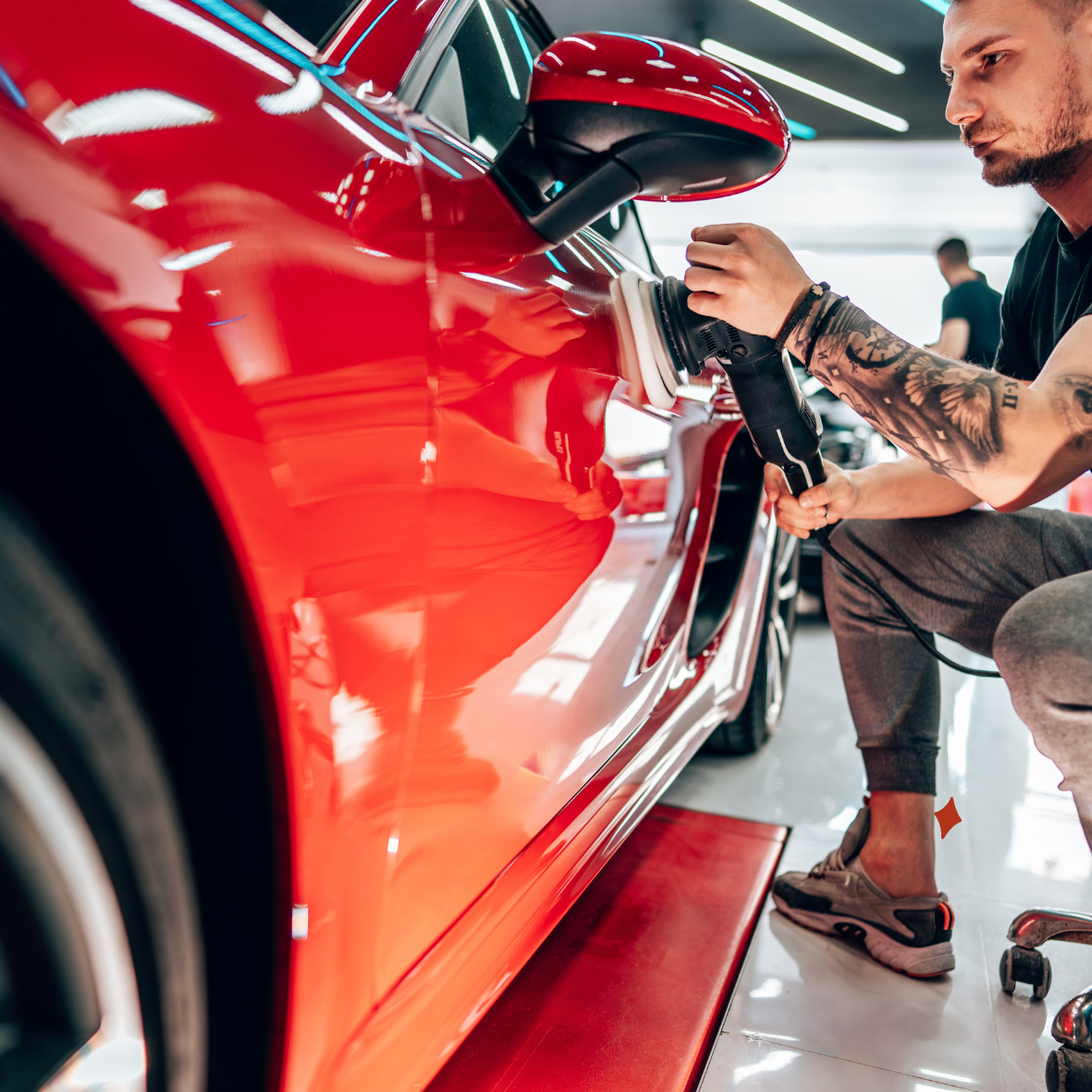 Technician performing close-up detailing on a car at Auto Shine Pro in Austin, Texas